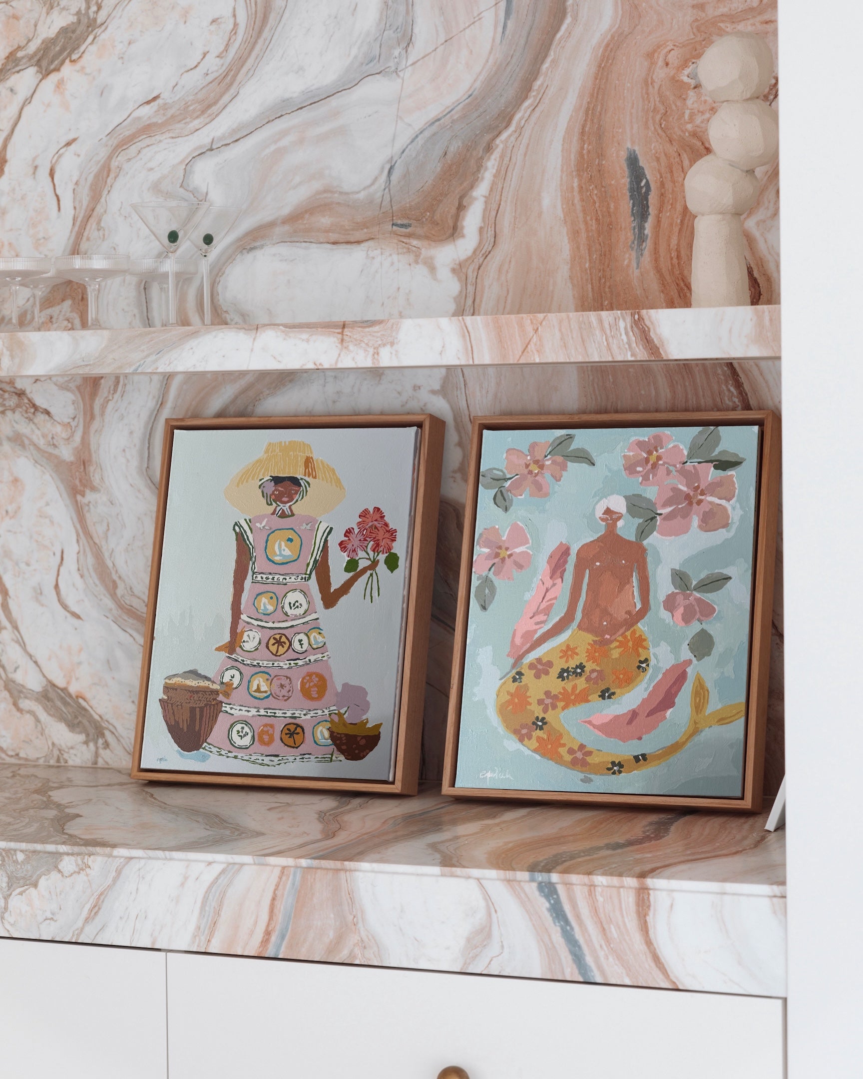 Paint Like Frida’s Patience and Lady of the Sea Mini Framed Canvases, styled on a marble shelf — two feminine paint by numbers artworks in small custom wooden floating frames, bringing colour and warmth to a modern home.